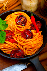 Image showing italian spaghetti pasta and tomato with mint leaves