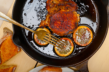 Image showing pork chop seared on iron skillet