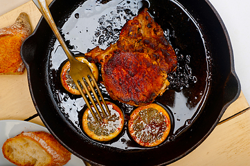 Image showing pork chop seared on iron skillet