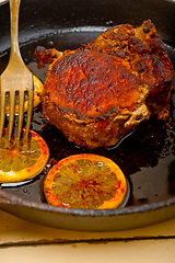 Image showing pork chop seared on iron skillet