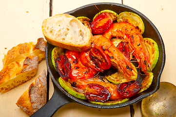 Image showing roasted shrimps with zucchini and tomatoes