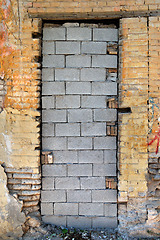 Image showing bricked up door and chipped brick wall texture
