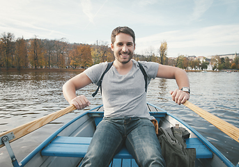 Image showing Man rowing on the river