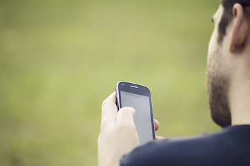 Image showing Man holding smartphone