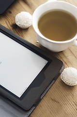 Image showing E-book reader and tea 