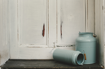 Image showing Vintage milk canisters.