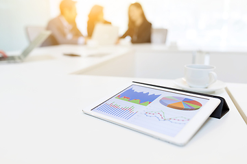 Image showing Digital tablet showing chart in meeting room