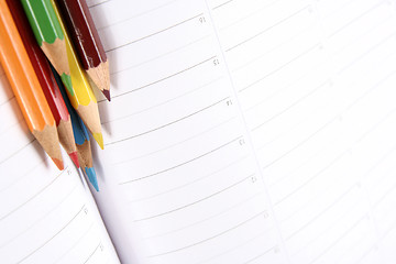 Image showing Color pencil and agenda