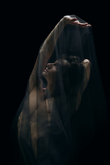 Image showing Graceful classic ballet dancer dancing isolated on dark studio background. The grace, artist, movement, action and motion concept.