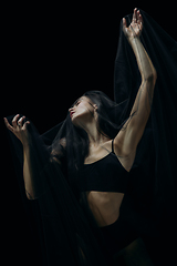 Image showing Graceful classic female ballet dancer isolated on black studio background. The grace, artist, movement, action and motion concept.