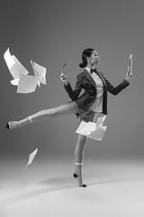 Image showing Young fashionable, stylish woman wearing jacket and socks working from home. Fashion during insulation \'cause of coronavirus pandemic