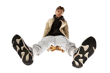 Image showing Young stylish man in modern street style outfit isolated on white background, shot from the bottom