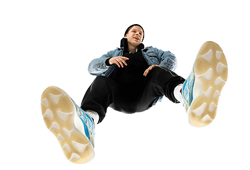 Image showing Young stylish man in modern street style outfit isolated on white background, shot from the bottom