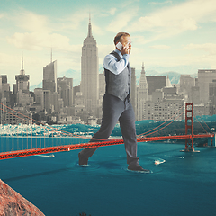 Image showing Office worker, huge businessman heading to work on the river through the bridge with megapolis on the background