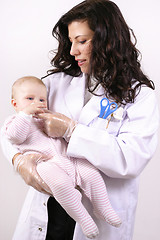 Image showing Medicating baby