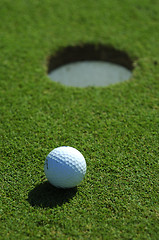 Image showing Golf ball close to the hole