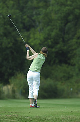 Image showing Woman golfer doing a swing