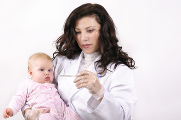 Image showing Doctor with baby and thermometer