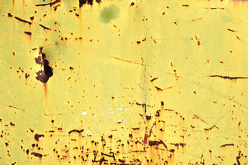 Image showing chipped yellow paint on rusty iron