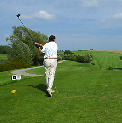 Image showing golfer doing a swing