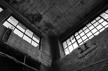 Image showing broken windows concrete wall in derelict factory