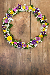 Image showing Natural Spring Flower Wreath on Rustic Wood Background