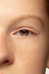 Image showing Close up portrait of beautiful redhair caucasian girl isolated on studio background. Beauty, fashion, skincare, cosmetics concept. Details.