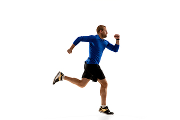 Image showing Caucasian professional runner, jogger training isolated on white studio background in fire