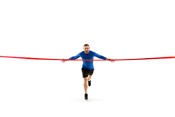 Image showing Caucasian professional runner, jogger training isolated on white studio background in fire