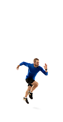 Image showing Caucasian professional runner, jogger training isolated on white studio background in fire