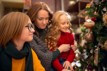 Image showing Smiling family, mother and kids looking for home decoration and holiday\'s gifts in household store