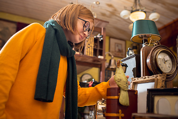 Image showing Cheerful little boy looking for home decoration and holiday\'s gifts in household store