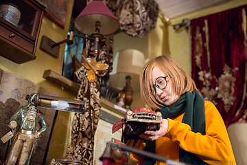 Image showing Cheerful little boy looking for home decoration and holiday\'s gifts in household store