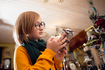 Image showing Cheerful little boy looking for home decoration and holiday\'s gifts in household store