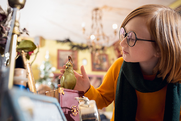 Image showing Cheerful little boy looking for home decoration and holiday\'s gifts in household store