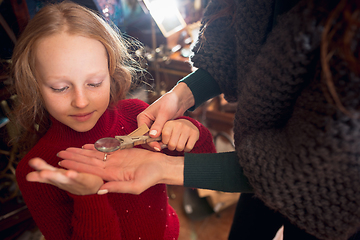 Image showing Cheerful family, mother and kids looking for home decoration and holiday\'s gifts in household store