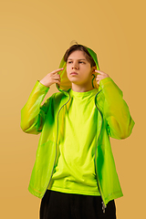 Image showing Old-school fashioned young man dancing isolated on yellow background