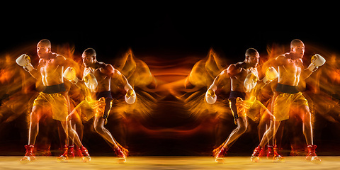 Image showing Professional boxer training on black studio background in mixed light. with strobe light, reflection, mirror effect. Collage