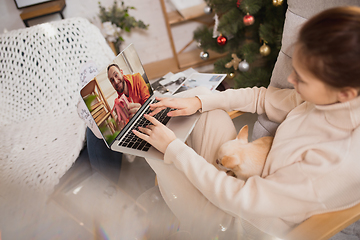 Image showing Young woman enjoying her domestic life. Home comfort, winter and holidays time