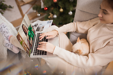 Image showing Young woman enjoying her domestic life. Home comfort, winter and holidays time