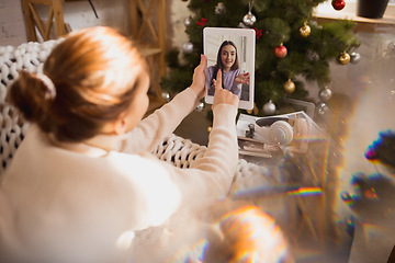 Image showing Young woman enjoying her domestic life. Home comfort, winter and holidays time