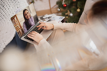 Image showing Young woman enjoying her domestic life. Home comfort, winter and holidays time