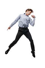 Image showing Happy young man dancing in casual clothes or suit, remaking legendary moves of celebrity from culture history