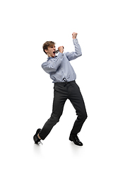 Image showing Happy young man dancing in casual clothes or suit, remaking legendary moves of celebrity from culture history