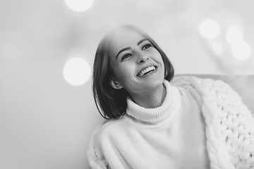 Image showing Portrait of beautiful woman isolated on white studio background. Comfort, warm in winter concept