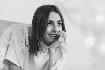 Image showing Portrait of beautiful woman isolated on white studio background. Comfort, warm in winter concept