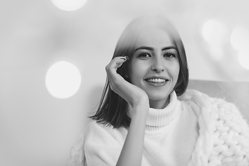 Image showing Portrait of beautiful woman isolated on white studio background. Comfort, warm in winter concept