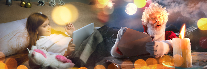 Image showing Happy caucasian little girl during video call or messaging with Santa using laptop and home devices, celebration or ad flyer with copyspace