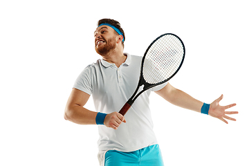 Image showing Funny emotions of professional tennis player isolated on white studio background, excitement in game