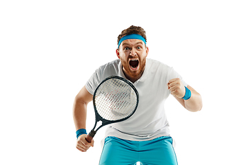 Image showing Funny emotions of professional tennis player isolated on white studio background, excitement in game